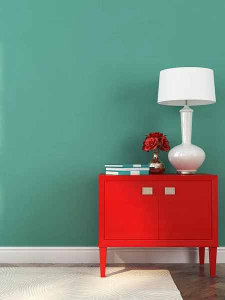 Red chest of drawers and lamp