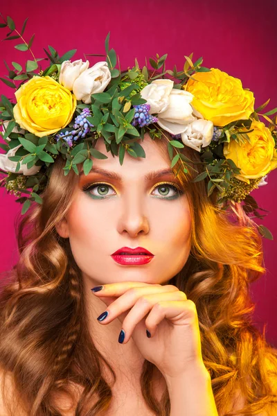 Gorgeous woman with wreath on hair