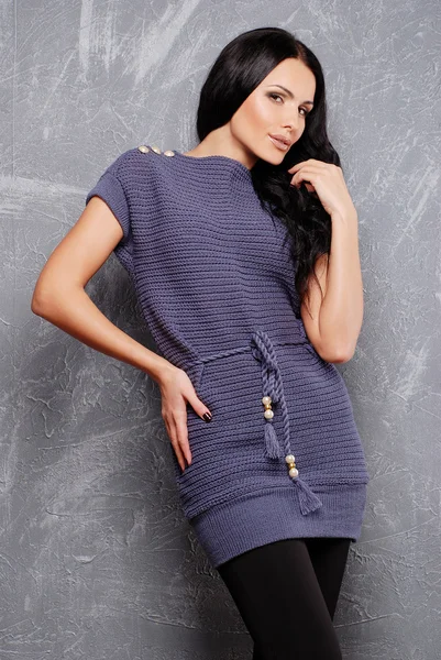 Attractive woman wearing knitted dress