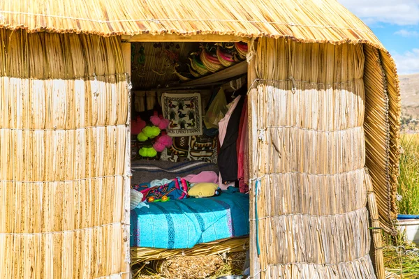 Thatched home on Floating Islands on Lake Titicaca Puno, Peru, South America
