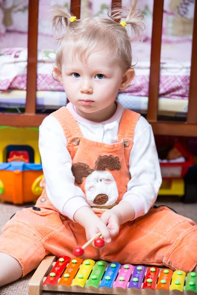 Child girl with musical instrument