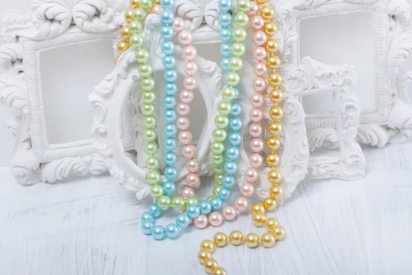Pearl necklaces on vintage frames