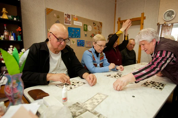 PODPOROZHYE, RUSSIA - MAY 3: Day of Health in Center of social services for pensioners and disabled (Lotto - exercises for development of attention for eldery), May 3, 2012 in Podporozhye, Russia.