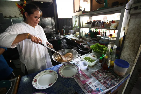 CHANG, THAILAND - JANUARY 23: Unknown vendors prepare food at a street side restaurant on Jan 23, 2012 in Chang, Thai