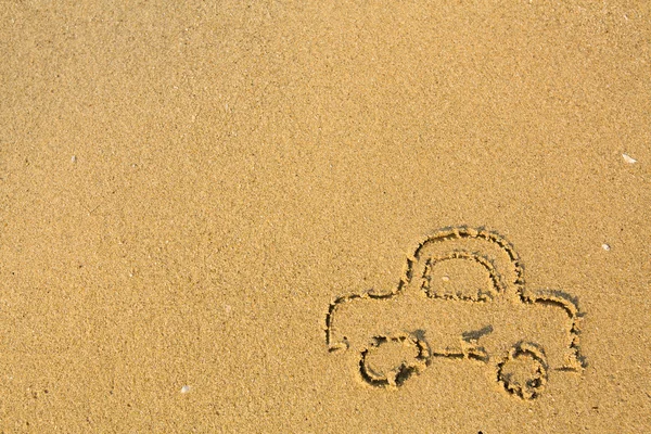 Car drawn on the beach sand