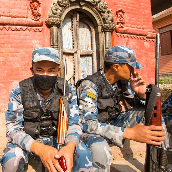 Unknown nepalese soldiers Armed Police Force near the public school