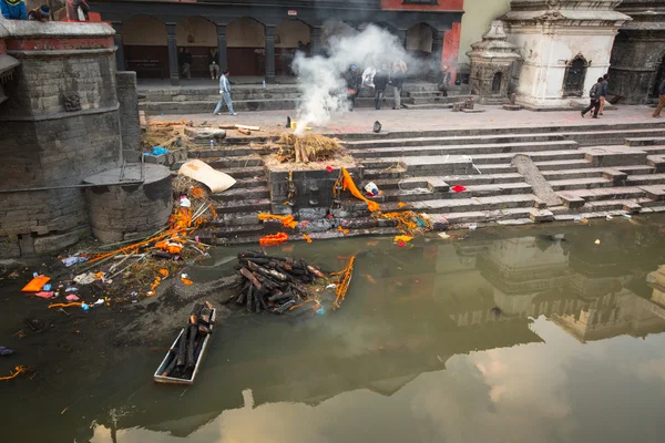 During the cremation ceremony along the holy Bagmati River