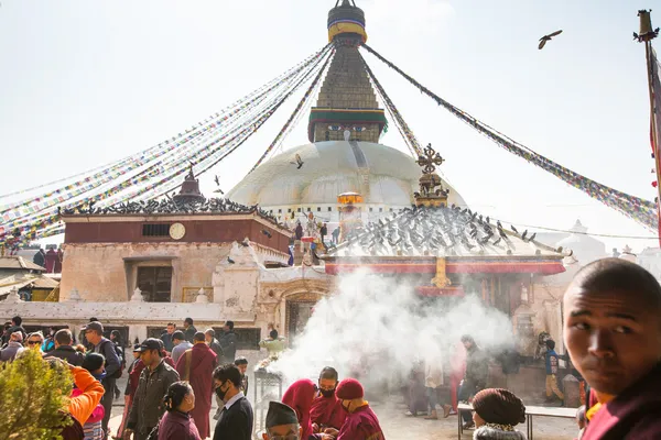 Unidentified tibetan Buddhist monks near stupa Boudhanath