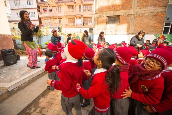 Unknown pupils during dance lesson in primary school in Nepal