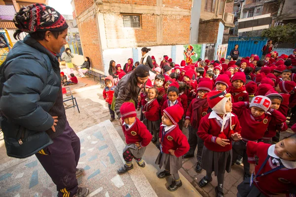 Unknown pupils during dance lesson in primary school in Nepal