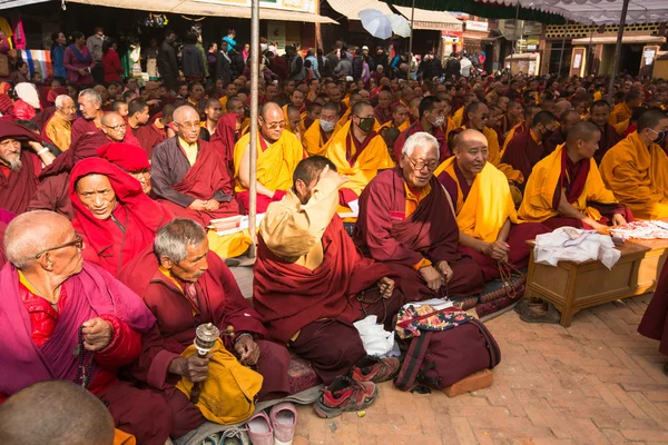 Buddhist monks near stupa Boudhanath in Nepal