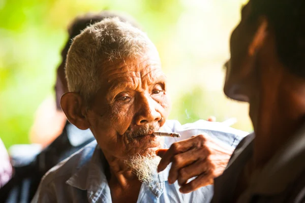 Unidentified old man Orang Asli in his village