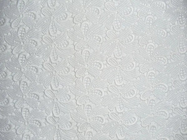 White lace fabric on the white background.