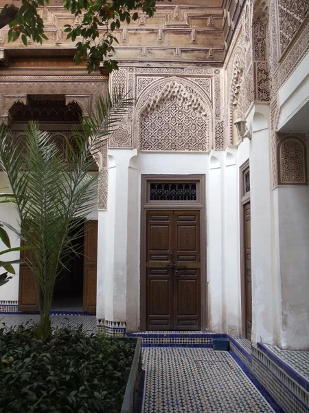 Ancient palace Bahia in Marrakech. Inside garden with the entrance into one of the rooms in the palace.