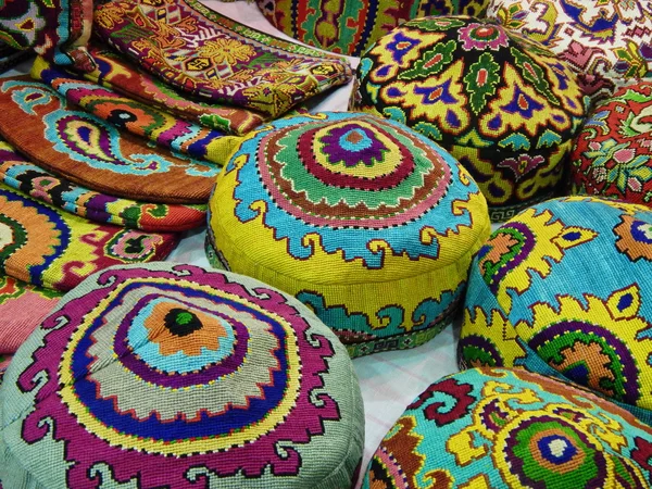 Folk crafts. National hats with oriental pattern embroidery.