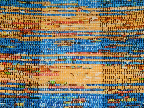 Folk crafts. A handmade rug.  As a background.