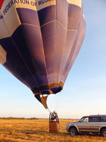 Getting the air balloon ready for the trip. The first flight. Active life. Summer ballooning. Russia. July, 2014.