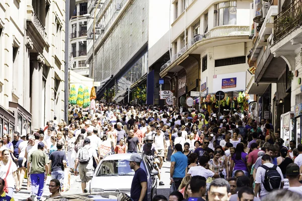 Hundreds of People walk along the 25 March area in Sao Paulo, Brazil.