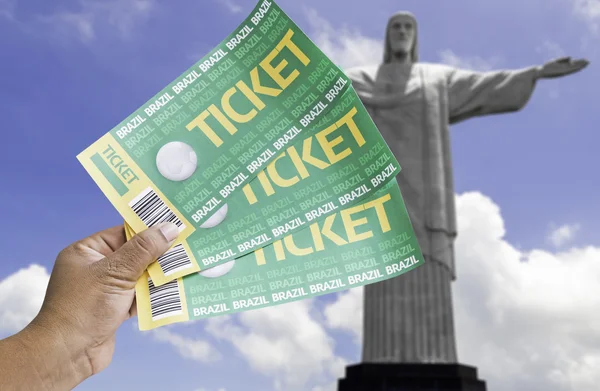 Hand holds soccer tickets in Rio de Janeiro, Brazil