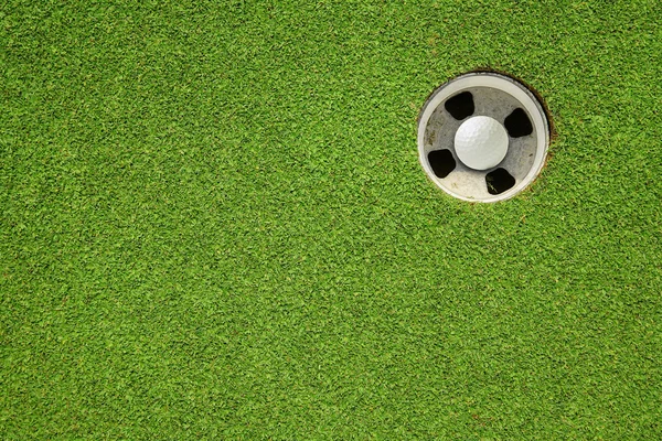 Golf hole on a field