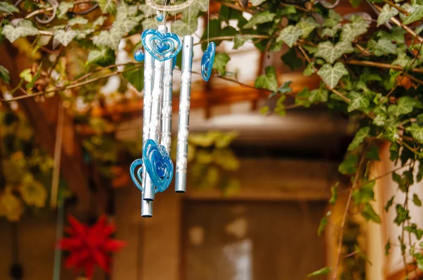 Chinese wind chimes with sakura flowers, motion blur