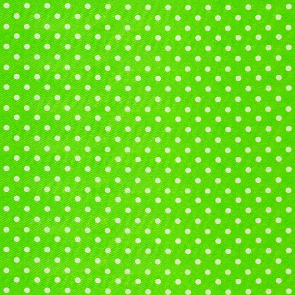 Image of green fabric with white polka dots