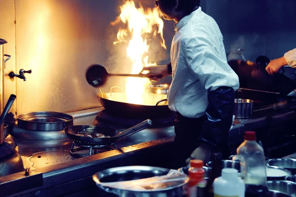 Motion chefs of a restaurant kitchen