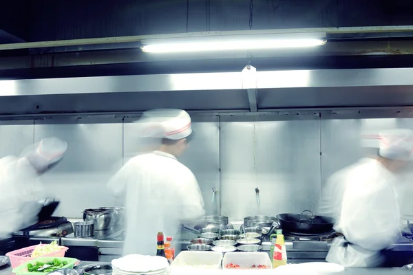 Motion chefs of a restaurant kitchen