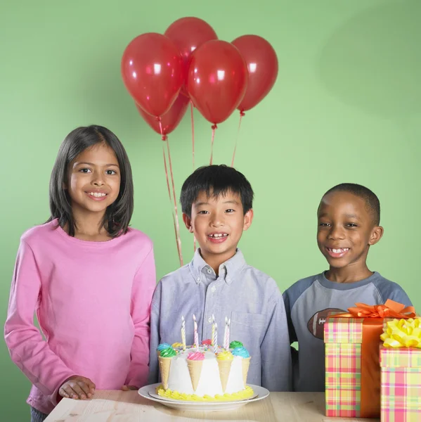 Multi-ethnic children at birthday party