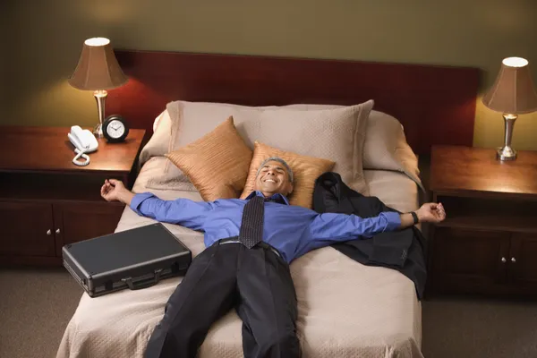 Businessman relaxing in his hotel room