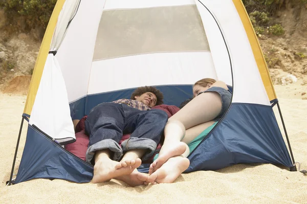 Couple laying in tent