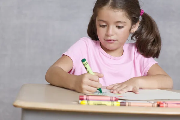 Close up of girl coloring picture