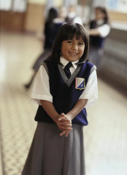 Young girl in private school uniform