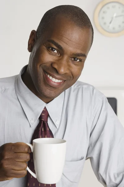 Businessman drinking a cup of coffee