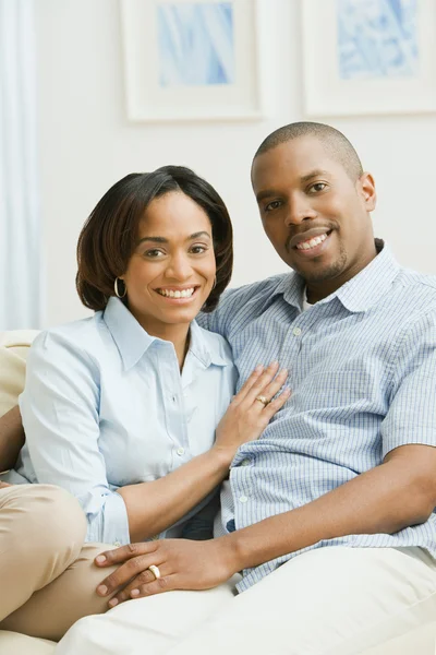 Portrait of African couple on sofa