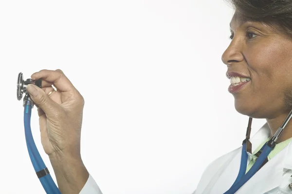 Profile of female doctor with stethoscope