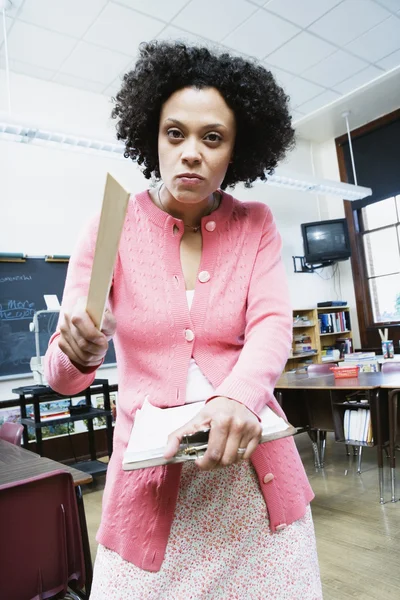 Portrait of angry teacher with ruler