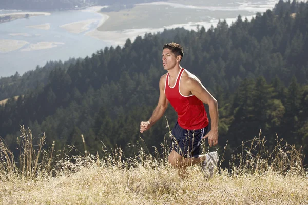 Male running on mountain trail