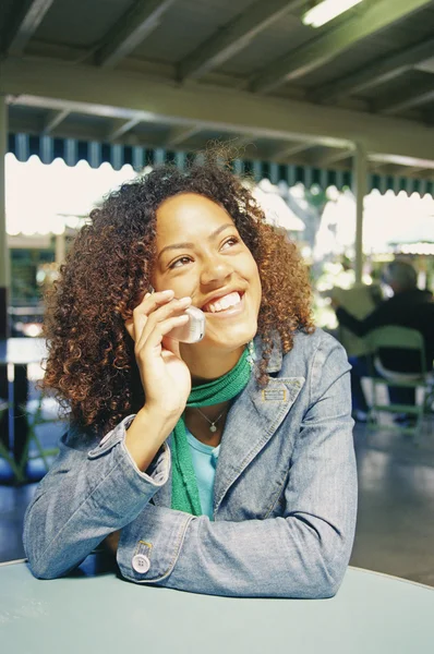 Portrait of young woman using cell phone