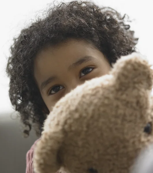 Young boy holding teddy bear