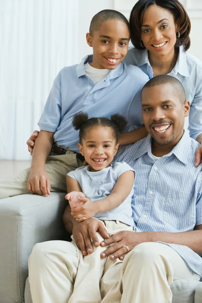 Portrait of African family on sofa