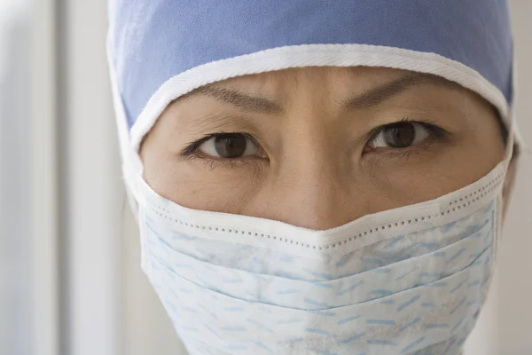 Close up of Asian female doctor wearing surgical mask