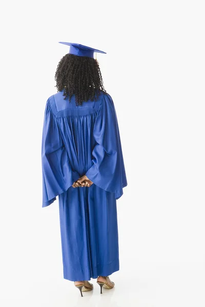 African American woman wearing graduation cap and gown