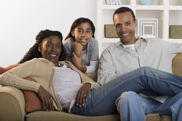 Portrait of family sitting on couch