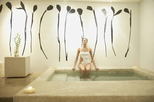 Woman relaxing in spa room