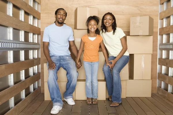 African family in back of moving truck