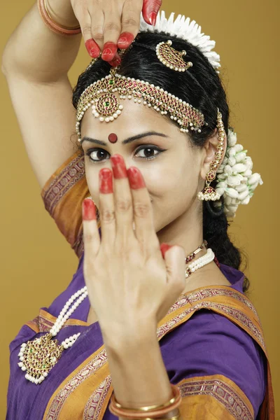 Indian woman dancing in traditional dress