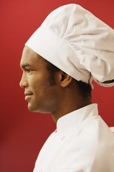 Side view of male chef wearing hat
