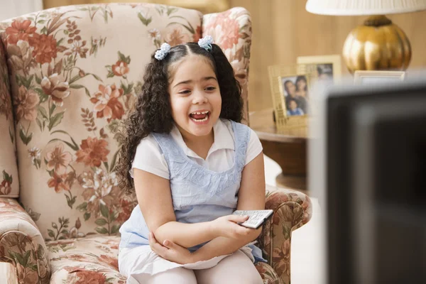 Young girl watching television