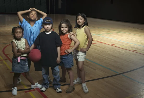 Portrait of group of children with basketball